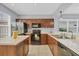 Kitchen featuring wood cabinets and modern appliances at 5532 River Sound Ter, Bradenton, FL 34208