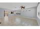 Open-concept living room features tile flooring and large windows at 5532 River Sound Ter, Bradenton, FL 34208