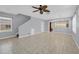 Spacious open-concept living room with tile floors and a staircase at 5532 River Sound Ter, Bradenton, FL 34208