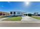 Well maintained single story home with a driveway and manicured lawn at 5619 Bayshore Rd # 152, Palmetto, FL 34221