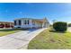 Charming single-story home with a long driveway and well-maintained landscaping at 5619 Bayshore Rd # 152, Palmetto, FL 34221