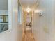 Hallway featuring wood floors and seamless access to other rooms at 5619 Bayshore Rd # 152, Palmetto, FL 34221