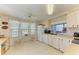 Well-lit kitchen featuring a breakfast nook, white appliances, and tile flooring at 5619 Bayshore Rd # 152, Palmetto, FL 34221