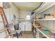 Organized laundry room featuring washer, dryer, shelving, and utility sink for added convenience at 5619 Bayshore Rd # 152, Palmetto, FL 34221