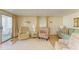 Cozy living room featuring neutral tones, plush seating, and a sliding glass door at 5619 Bayshore Rd # 152, Palmetto, FL 34221