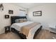 Relaxing main bedroom with a large bed, neutral decor, bedside tables, and a window at 5868 Calla Lilly Dr, Sarasota, FL 34232