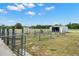 Property includes a fenced yard and storage shed offering ample space and utility for outdoor activities at 5949 225Th E St, Bradenton, FL 34211