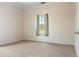 Neutral bedroom featuring a carpeted floor, window, and neutral walls at 5949 225Th E St, Bradenton, FL 34211