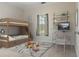 Comfortable bedroom with a bunk bed, desk, and shelving creating an inviting space at 5949 225Th E St, Bradenton, FL 34211