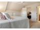 Tranquil bedroom featuring a ceiling fan, white walls, carpet flooring, and doorway to another room at 5949 225Th E St, Bradenton, FL 34211