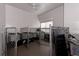 Dog kennels with metal gates and concrete flooring at 5949 225Th E St, Bradenton, FL 34211
