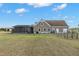 Rear exterior view of home with screened-in lanai at 5949 225Th E St, Bradenton, FL 34211