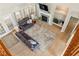 Bright living room with neutral colors, hard wood floors, and fireplace at 5949 225Th E St, Bradenton, FL 34211