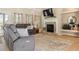 Inviting living room with a cozy fireplace and neutral decor at 5949 225Th E St, Bradenton, FL 34211