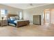 Spacious primary bedroom with tile floors, natural light, and ensuite bathroom access at 5949 225Th E St, Bradenton, FL 34211