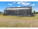 The home features a large screened porch, perfect for outdoor living and entertaining in a rural setting at 5949 225Th E St, Bradenton, FL 34211