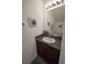 Bathroom features a single sink with granite countertop and decorative accents at 6473 Baytown Dr, Sarasota, FL 34240
