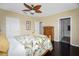 Bedroom features wood floors and a view into the ensuite bathroom at 6473 Baytown Dr, Sarasota, FL 34240