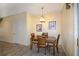 Cozy dining room features a wooden table and chairs with art on the walls at 6473 Baytown Dr, Sarasota, FL 34240