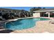 Community pool with lounge chairs and well maintained grounds create a relaxing and inviting atmosphere at 6473 Baytown Dr, Sarasota, FL 34240