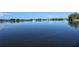 Picturesque water view overlooking serene open water with boats docked along the distant shoreline at 767 Pine Run Dr, Osprey, FL 34229