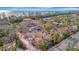 Expansive property surrounded by mature trees offers an exceptional canvas for your dream home at 8555 Heron Lagoon Cir, Sarasota, FL 34242