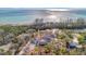 Aerial shot captures the new construction's desirable positioning relative to the beach at 8555 Heron Lagoon Cir, Sarasota, FL 34242