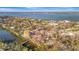 Aerial image displays waterfront homes and peaceful canal, emphasizing the tranquility and luxury of waterfront living at 8555 Heron Lagoon Cir, Sarasota, FL 34242
