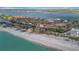 Wide aerial view of the property from the beach side at 8555 Heron Lagoon Cir, Sarasota, FL 34242
