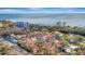 Aerial shot captures the home's desirable positioning relative to the beach at 8555 Heron Lagoon Cir, Sarasota, FL 34242