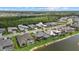 Beautiful aerial view of a residential community with lakefront properties and mature trees at 9241 Starry Night Ave, Sarasota, FL 34241