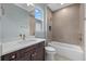 Well-lit bathroom boasting a soaking tub, and vanity with quartz countertops at 9241 Starry Night Ave, Sarasota, FL 34241