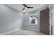 Cozy bedroom featuring a ceiling fan and a window with a bright outdoor view at 9241 Starry Night Ave, Sarasota, FL 34241