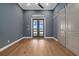 Spacious, bright bedroom with hardwood floors, barn doors, and a view of the waterfront at 9241 Starry Night Ave, Sarasota, FL 34241