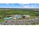 Community center aerial view showcasing the resort-style pool, clubhouse, and surrounding lush landscaping at 9241 Starry Night Ave, Sarasota, FL 34241