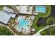 Aerial view of community pools, a splash pad, and a hot tub, perfect for relaxing and socializing at 9241 Starry Night Ave, Sarasota, FL 34241