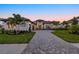 Elegant home with well-manicured lawn and brick driveway at 9241 Starry Night Ave, Sarasota, FL 34241