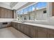 Well-appointed kitchen featuring stainless steel appliances, lots of counter space, and custom cabinetry at 9241 Starry Night Ave, Sarasota, FL 34241