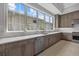 Kitchen offers stainless steel appliances, custom cabinetry, and generous counter space at 9241 Starry Night Ave, Sarasota, FL 34241