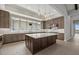 Well-equipped kitchen featuring stainless steel appliances, generous counter space and custom cabinetry at 9241 Starry Night Ave, Sarasota, FL 34241