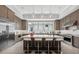 Beautiful kitchen with seating around the center island, stainless steel appliances and ample counter space at 9241 Starry Night Ave, Sarasota, FL 34241
