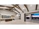 Open floor plan featuring beamed ceilings and a kitchen with island at 9241 Starry Night Ave, Sarasota, FL 34241
