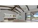 Expansive living area with beamed ceilings, modern chandeliers and open-concept kitchen at 9241 Starry Night Ave, Sarasota, FL 34241