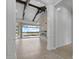 Bright, open-concept living area with beamed ceilings, modern fireplace and sliding doors to the patio at 9241 Starry Night Ave, Sarasota, FL 34241