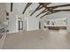 Spacious living area with tiled floors, fireplace and open-concept kitchen at 9241 Starry Night Ave, Sarasota, FL 34241