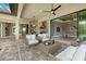Inviting outdoor patio with comfortable seating, grill, and seamless transition to an indoor game room at 9241 Starry Night Ave, Sarasota, FL 34241
