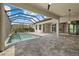 Luxurious screened-in pool area with spacious patio, perfect for relaxing and entertaining at 9241 Starry Night Ave, Sarasota, FL 34241