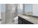 Stylish bathroom with glass shower, granite counter top, and decorative tile accent at 9914 Craftsman Park Way, Palmetto, FL 34221