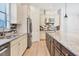 Modern kitchen with granite countertops, stainless steel refrigerator, and ample cabinet space at 9914 Craftsman Park Way, Palmetto, FL 34221