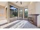 Covered outdoor living area with a brick fireplace, ceiling fan, and a brick surround at 9914 Craftsman Park Way, Palmetto, FL 34221